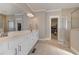 Bathroom featuring double sinks, a walk-in shower, and a large walk-in closet at 108 Jasmine Way, Villa Rica, GA 30180