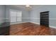 Bedroom with hardwood floors, large window, and natural light at 108 Jasmine Way, Villa Rica, GA 30180