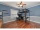 Bedroom featuring a lofted bed and hardwood flooring at 108 Jasmine Way, Villa Rica, GA 30180