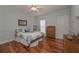 Bedroom featuring hardwood floors, bed, and natural light at 108 Jasmine Way, Villa Rica, GA 30180