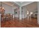 Elegant dining room features beautiful hardwood floors, chandelier, and wainscoting at 108 Jasmine Way, Villa Rica, GA 30180