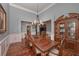 Formal dining room with hardwood floors, chandelier, and ample space for entertaining at 108 Jasmine Way, Villa Rica, GA 30180
