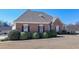 Charming brick home featuring decorative shutters and landscaping, enhancing the property's appeal at 108 Jasmine Way, Villa Rica, GA 30180
