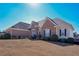 Beautiful brick home with a well-manicured lawn and garden area, offering curb appeal at 108 Jasmine Way, Villa Rica, GA 30180