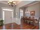 Grand foyer with hardwood floors, chandelier, and direct access to the dining room at 108 Jasmine Way, Villa Rica, GA 30180