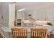 Bright kitchen featuring white cabinets, granite countertops, and stainless steel appliances at 108 Jasmine Way, Villa Rica, GA 30180