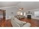 Spacious living room with a fireplace, hardwood floors, and open to the kitchen at 108 Jasmine Way, Villa Rica, GA 30180