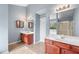 Bathroom features dual vanities, tub and shower at 1558 Autumn Wood Trl, Sugar Hill, GA 30518