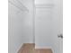 Walk-in closet features white wire shelving for organization at 1558 Autumn Wood Trl, Sugar Hill, GA 30518