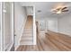 Inviting foyer with staircase leads to hardwood flooring and living space at 1558 Autumn Wood Trl, Sugar Hill, GA 30518