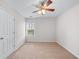 Bedroom with neutral carpet, white walls, and a ceiling fan at 1558 Autumn Wood Trl, Sugar Hill, GA 30518