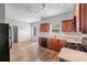 Spacious kitchen with cherry cabinets, modern appliances, and hardwood flooring at 1558 Autumn Wood Trl, Sugar Hill, GA 30518