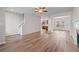 Bright living room with hardwood floors and an open floor plan at 1558 Autumn Wood Trl, Sugar Hill, GA 30518