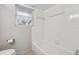 Clean bathroom featuring a bathtub, toilet, and window for natural light at 290 Lakemoore Ne Dr # C, Atlanta, GA 30342