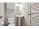 Cozy bathroom featuring a pedestal sink, vanity cabinet, and decorative lighting at 290 Lakemoore Ne Dr # C, Atlanta, GA 30342