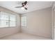 Well-lit bedroom with new carpet, ceiling fan and natural light from large windows at 290 Lakemoore Ne Dr # C, Atlanta, GA 30342