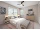 Well-lit bedroom featuring a ceiling fan, contemporary furnishings, and a patterned rug at 290 Lakemoore Ne Dr # C, Atlanta, GA 30342