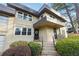 Inviting exterior of a two-story townhome with well-maintained landscaping and a covered entry at 290 Lakemoore Ne Dr # C, Atlanta, GA 30342