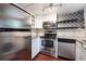 Updated kitchen with stainless steel appliances, granite countertops, and decorative backsplash at 290 Lakemoore Ne Dr # C, Atlanta, GA 30342
