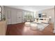 Inviting living room with a plush sofa, decorative ottomans, and hardwood floors at 290 Lakemoore Ne Dr # C, Atlanta, GA 30342