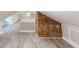 Spacious attic featuring light wood floors and brick accent wall, perfect for flex space at 3345 Flowers Dr, Atlanta, GA 30337