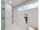 Stunning bathroom with sleek marble-style tile, and modern fixtures, creating a spa-like retreat at 3345 Flowers Dr, Atlanta, GA 30337