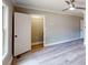Bright bedroom showcasing wood floors, a ceiling fan, and a closet for maximum space at 3345 Flowers Dr, Atlanta, GA 30337