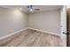 Comfortable bedroom with light-colored walls, light wood floors, and an open floor plan at 3345 Flowers Dr, Atlanta, GA 30337