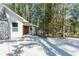 View of the front entrance with stone accents and new concrete driveway highlighting the home's curb appeal at 3345 Flowers Dr, Atlanta, GA 30337