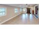 Bright living room featuring tile floors, multiple windows, and open access to other rooms at 3345 Flowers Dr, Atlanta, GA 30337