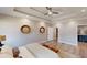 Well lit main bedroom with tray ceilings, neutral walls, and two large circular mirrors at 3345 Flowers Dr, Atlanta, GA 30337