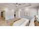 Bright bedroom features wood floors, tray ceilings, and an en-suite bathroom at 3345 Flowers Dr, Atlanta, GA 30337
