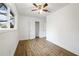 This bedroom features a closet, a window, and wood-look floors at 1506 Sycamore Nw Dr, Kennesaw, GA 30152