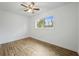 This bedroom features a window, neutral walls, and wood-look floors at 1506 Sycamore Nw Dr, Kennesaw, GA 30152