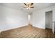 This spacious bedroom features wood-look flooring and a ceiling fan at 1506 Sycamore Nw Dr, Kennesaw, GA 30152