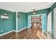 Dining room with hardwood floors and blue accent walls at 172 Shallow Ridge Ne Ln, Kennesaw, GA 30144