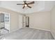 Neutral main bedroom featuring trey ceiling, ceiling fan, neutral walls, carpet flooring and adjoining bath at 172 Shallow Ridge Ne Ln, Kennesaw, GA 30144