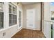 Inviting balcony with wood tile flooring and white railings at 220 Renaissance Ne Pkwy # 1205, Atlanta, GA 30308