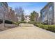 Beautifully landscaped courtyard with manicured shrubs and walking paths at 220 Renaissance Ne Pkwy # 1205, Atlanta, GA 30308