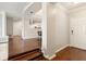 Welcoming foyer with hardwood floors transitions seamlessly to kitchen and living areas at 220 Renaissance Ne Pkwy # 1205, Atlanta, GA 30308