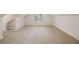 Spacious attic with carpet, a window, and built-in shelving in the alcove at 2374 Havenridge Nw Dr, Atlanta, GA 30305