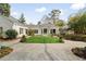 Expansive backyard featuring a manicured lawn, stone patio and elegant landscaping at 2374 Havenridge Nw Dr, Atlanta, GA 30305