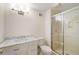 Bathroom featuring a marble sink vanity and glass enclosed shower at 2374 Havenridge Nw Dr, Atlanta, GA 30305