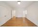 Bright bedroom features hardwood floors, white walls, and closet for storage at 2374 Havenridge Nw Dr, Atlanta, GA 30305