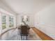 Elegant dining room with hardwood floors, decorative molding, a bay window, and heron artwork at 2374 Havenridge Nw Dr, Atlanta, GA 30305