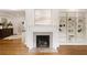 A fireplace with a marble hearth and built-in shelving for decor at 2374 Havenridge Nw Dr, Atlanta, GA 30305