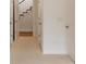 Bright hallway with many white doors leads to the staircase at 2374 Havenridge Nw Dr, Atlanta, GA 30305