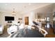 Open-concept living room flows into a kitchen with bar seating and stainless steel appliances at 2374 Havenridge Nw Dr, Atlanta, GA 30305