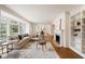 A traditional living room featuring hardwood floors, a fireplace, and a large bay window at 2374 Havenridge Nw Dr, Atlanta, GA 30305