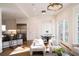 Inviting living room flows into a kitchen with bar seating and a bright dining area at 2374 Havenridge Nw Dr, Atlanta, GA 30305